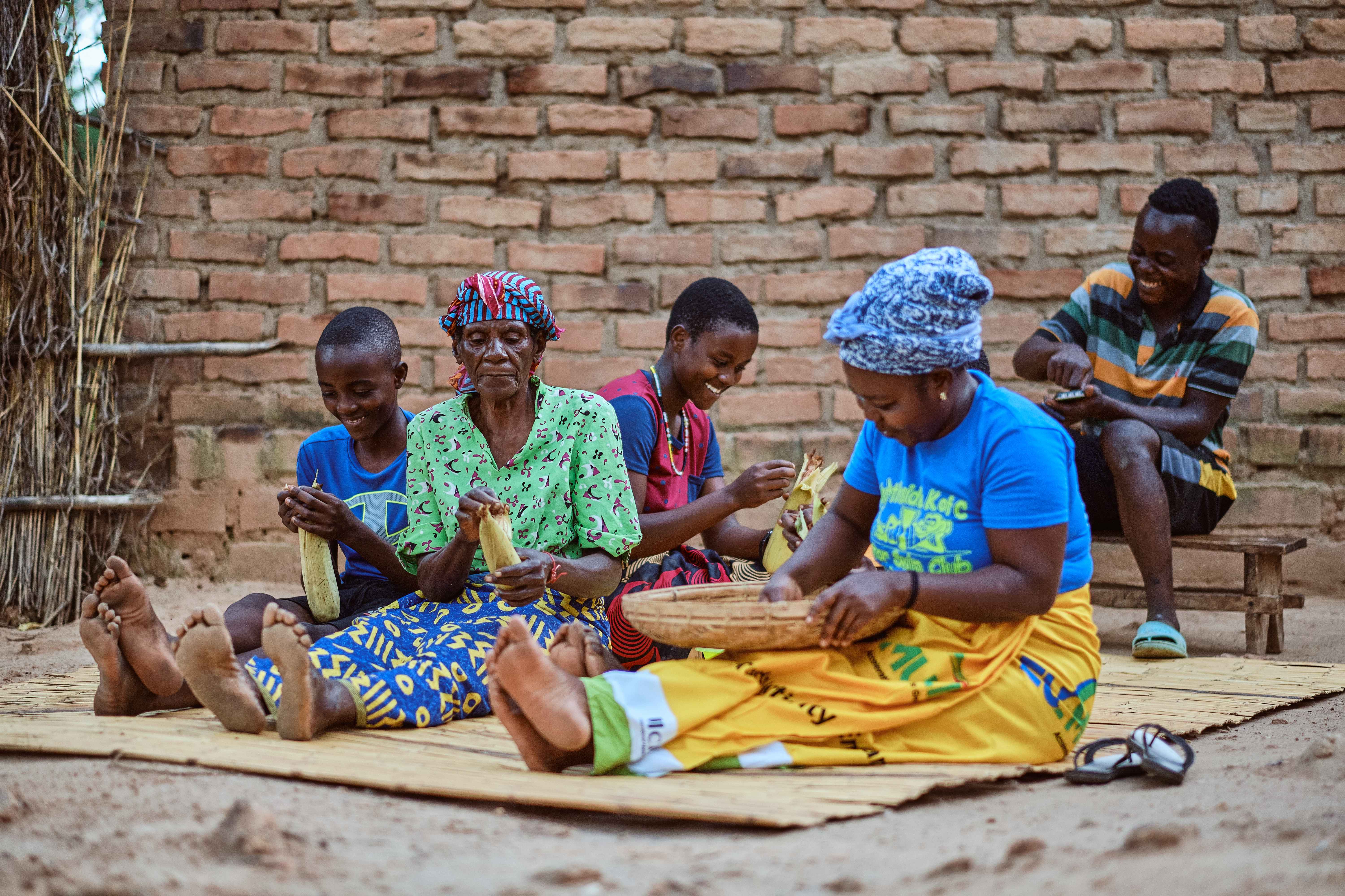 Mercy Mwape Kaunda with her husband at their Home and Cassava Field in Chiengi District Zambia