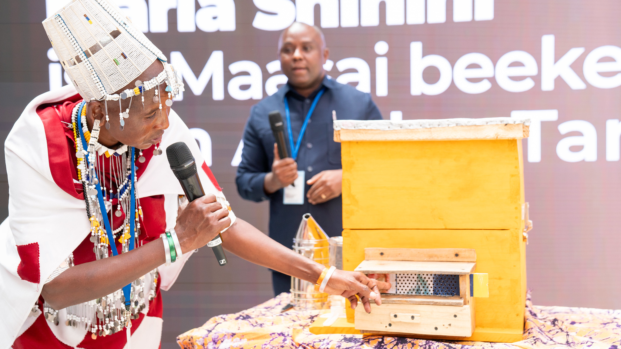Maasai beekeeper Maria Shinini at FAO HQ. ©FAO/Roberto Cenciarelli Maasai beekeeper Maria Shinini has travelled from her village in Northern Tanzania to FAO headquarters to show us how producing honey has changed her life.